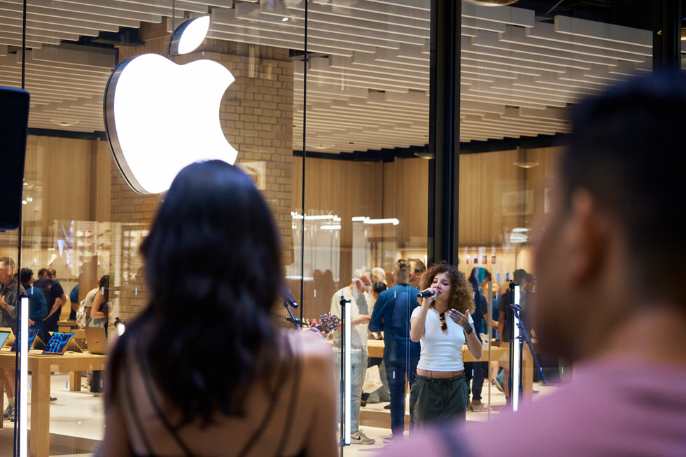 Musician JGrrey performs at the opening of Apple Battersea.