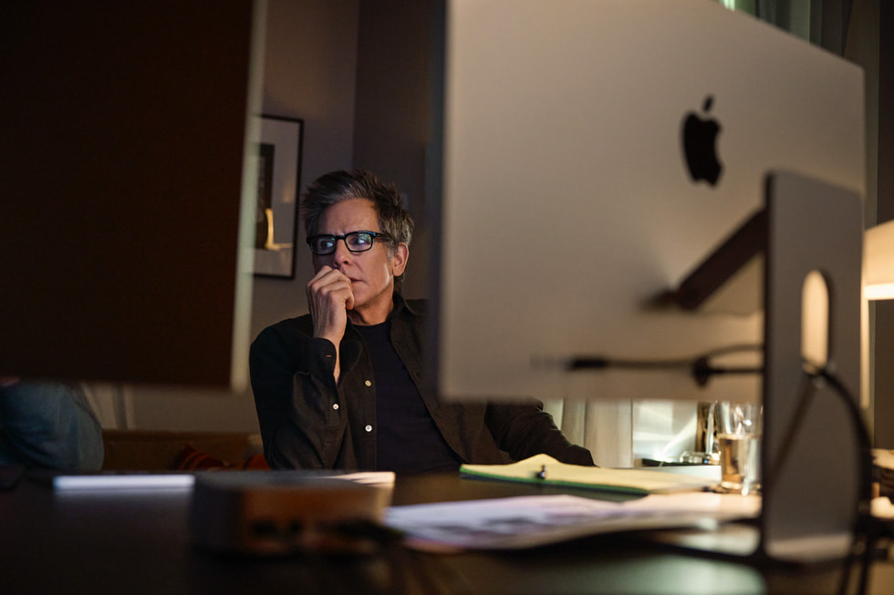 Geoffrey Richman and Ben Stiller sitting in front of a Mac workstation.