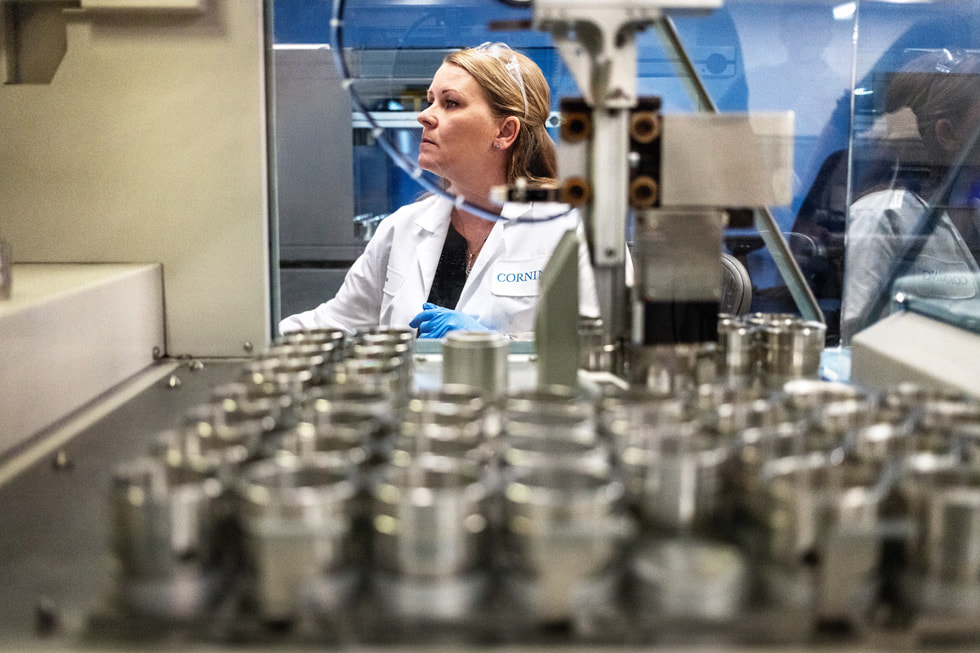 A worker in a lab coat at Corning’s Harrodsburg, Kentucky, facility.