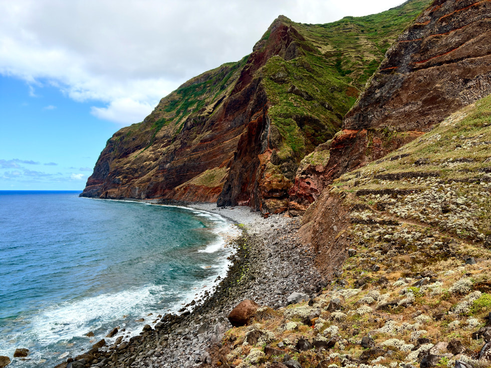 A photo taken with iPhone 17 features a coastal landscape.