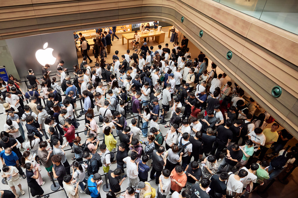 In a photo shot from above, customers fill a bustling Apple Nanjing East in Shanghai.
