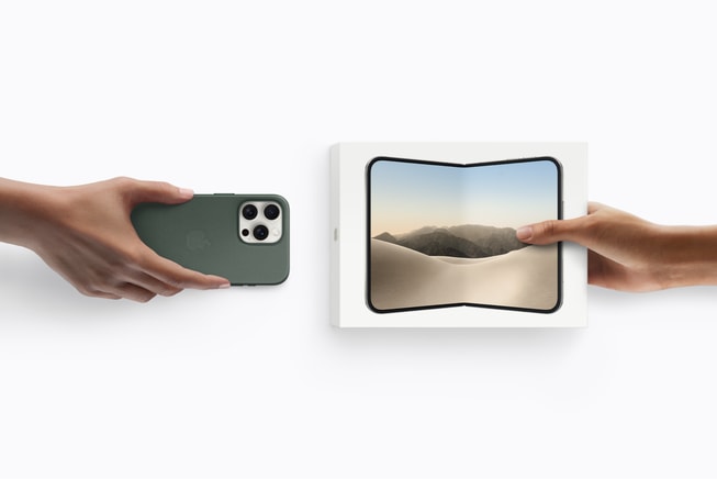 One hand holds an unboxed iPhone device, while another hand holds a boxed iPhone Duo.