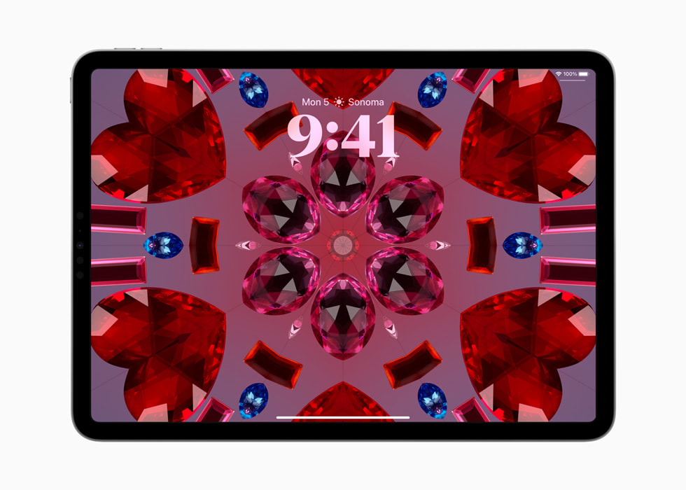 iPad Pro shows the kaleidoscope wallpaper.