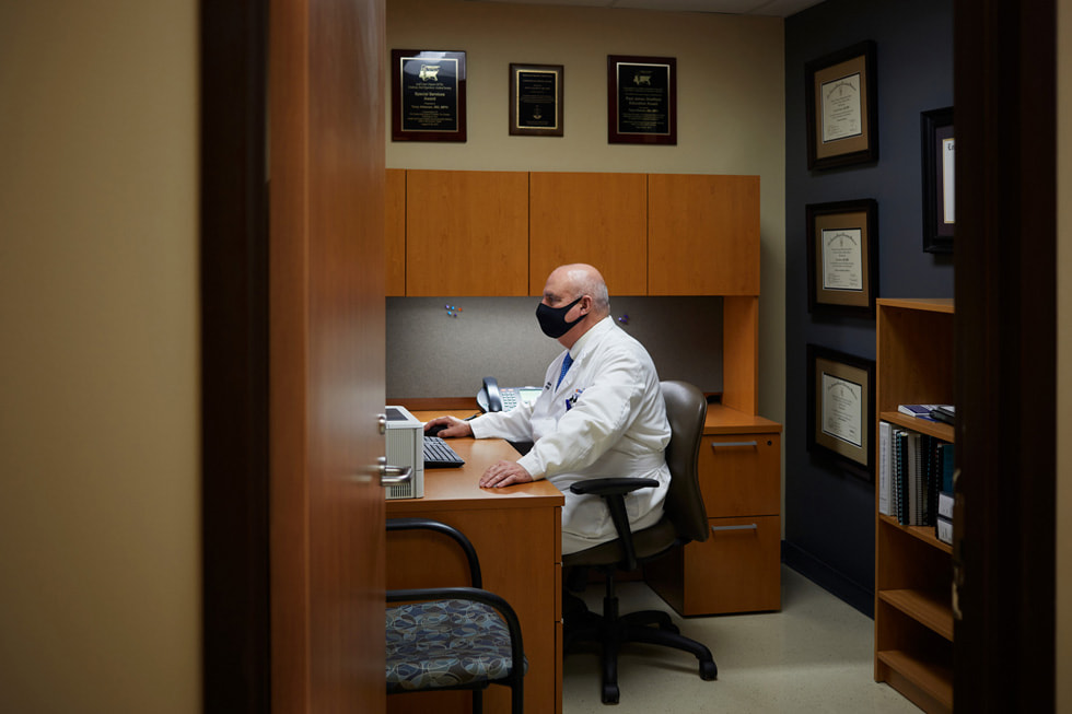 Dr. Tony Alleman of Regional One Health’s Wound Care Center working in his office.
