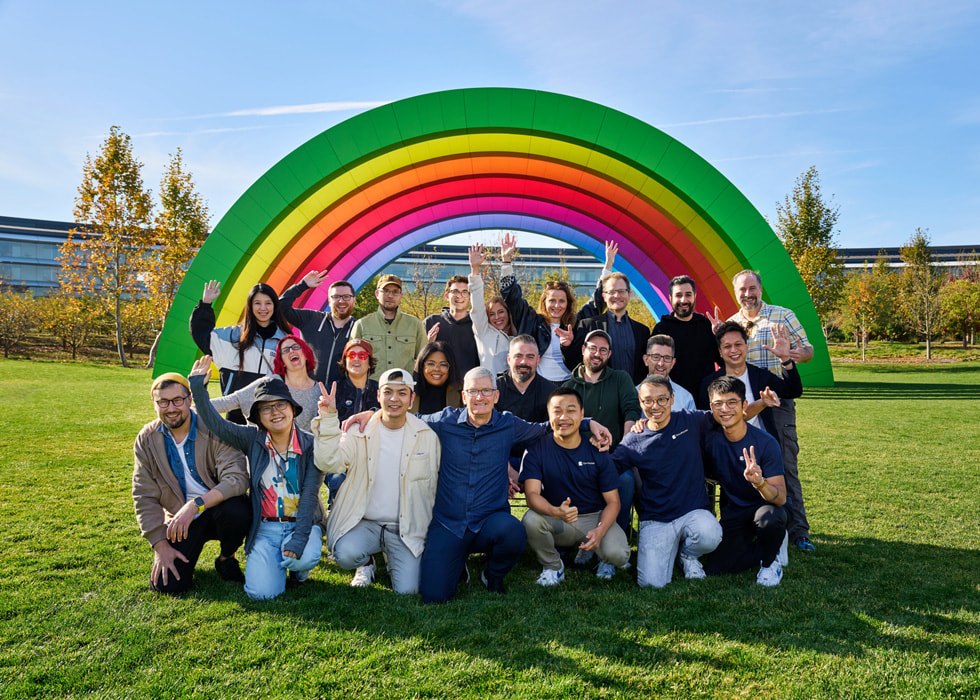 Apple CEO Tim Cook poses at Apple Park with the developers who won the 2022 App Store Awards.