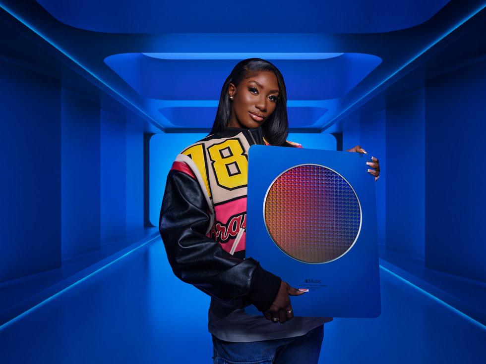Pop singer Aya Naka poses with an Apple Music Award.