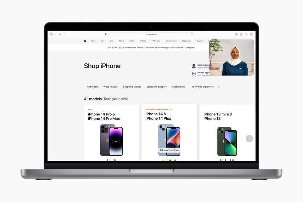 The Shop with a Specialist over Video experience is shown over an [apple.com] (https://applews.online-now.beer) page reading “Compare iPhone models” and showing iPhone 14 Pro Max, iPhone 14 Plus, and iPhone 14.