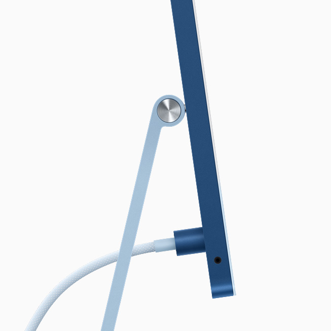 Side view of blue iMac showing power connector and woven, color-matched cable.