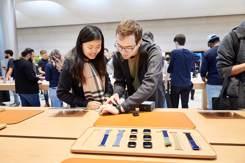 Customers trying on Apple Watch Series 5 in the new Apple Watch Studio.