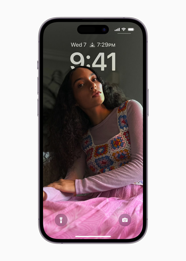 The reimagined Lock Screen in iOS 16 is shown.
