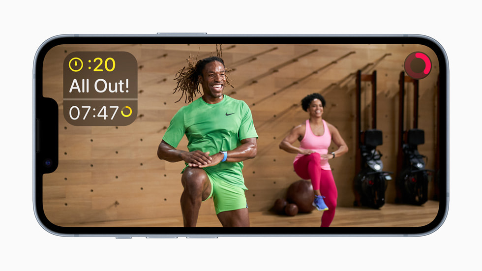 An Apple Fitness+ trainer leads a workout.