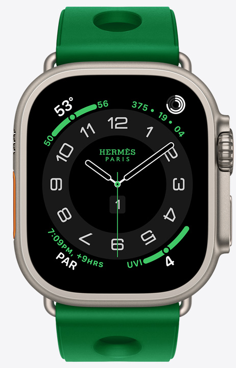 Apple Watch Hermès Ultra 4, analoges Circulaire Zifferblatt, (Stunden-, Minuten- und Sekundenzeiger, Komplikationen: Wetter, Aktivitätsringe, Paris Zeit und UV Index), Titangehäuse, Farbe Natur, rechte Seitenansicht, Digital Crown, erhöhte Seitentaste, kombiniert mit Scub’H Diving Armband, Farbe Vert Vertigo (Hellgrün), geformtes Gummimaterial, kreisförmige Aussparungen in der Mitte