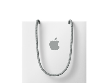 حقيبة تسوّق بيضاء من Apple، ومقبض رمادي، وشعار Apple الرمادي في الوسط