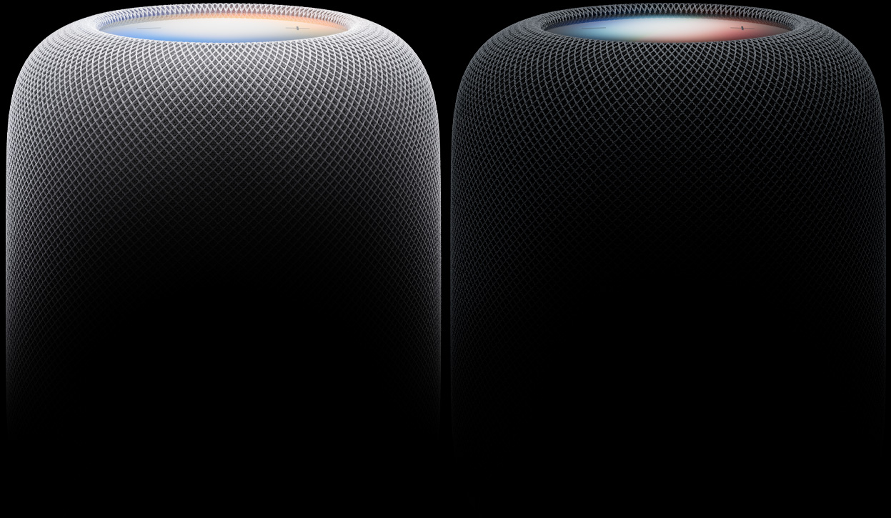 Two HomePod speakers side by side, white colour and midnight color, woven acoustic mesh fabric, illuminated touch surfaces