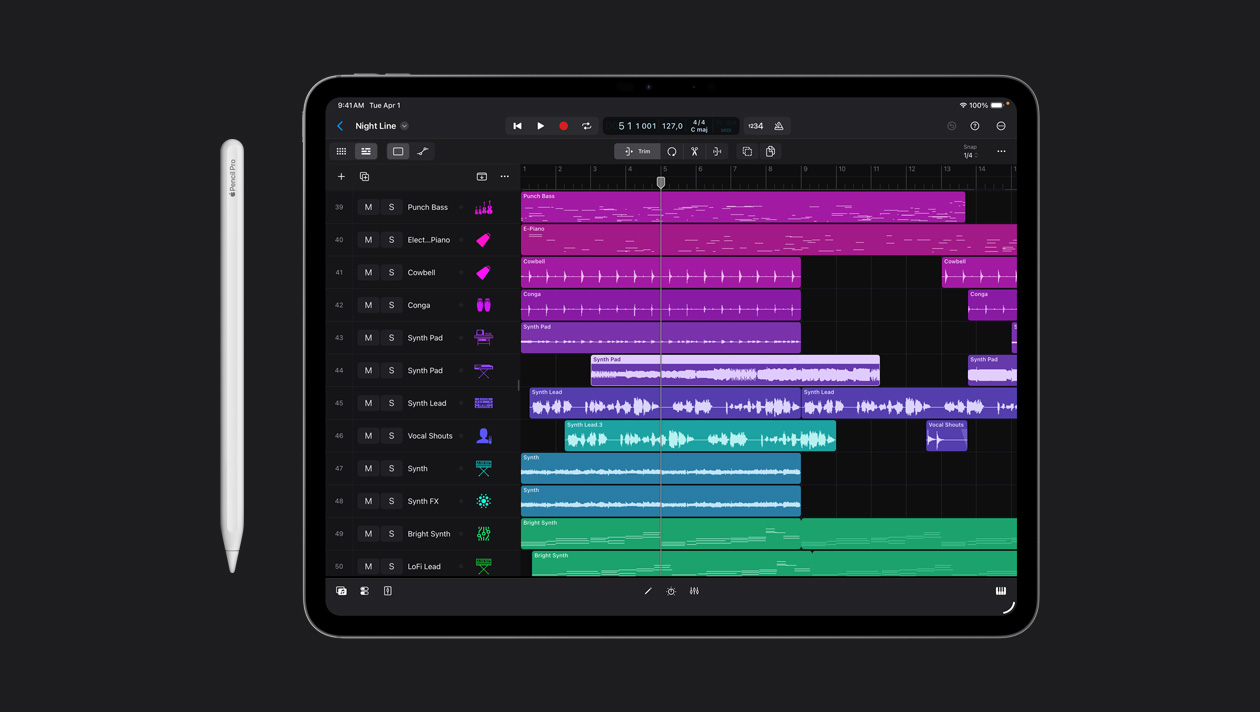 iPad Pro 13 screen showing Logic Pro workspace, list of different instruments on the left panel and their soundwaves in different colors on the right, Apple Pencil to the left of device