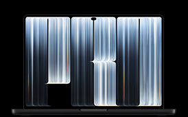 MacBook Pro con pantalla PROLED XDR, color negro espacial, abierta, la pantalla muestra una serie de objetos en forma de cinta con un patrón de rayas luminosas de distintos anchos que forman la palabra Pro