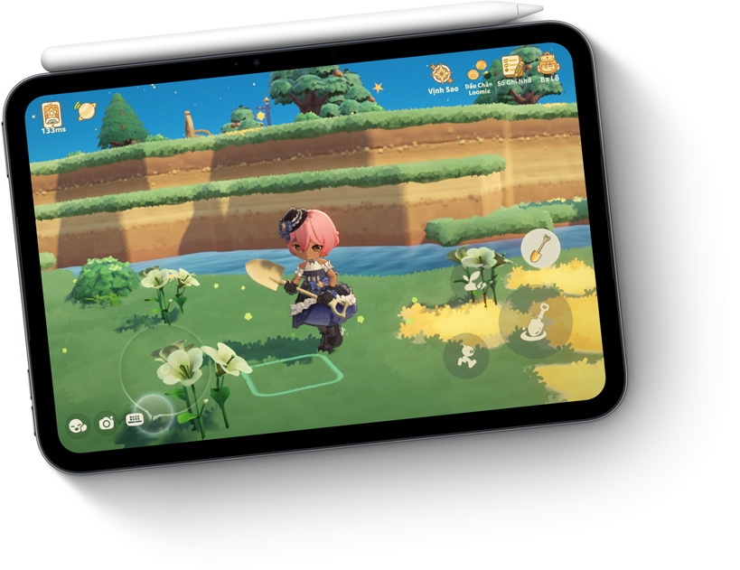 iPad mini, displayed in Midnight color, showing game on screen, with Apple Pencil attached magnetically on the top.